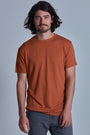 ONNO bamboo t-shirt in Rust Unpatched, Nic is 5'11" and wearing size M.