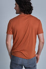 ONNO bamboo t-shirt in Rust Unpatched, Nic is 5'11" and wearing size M.