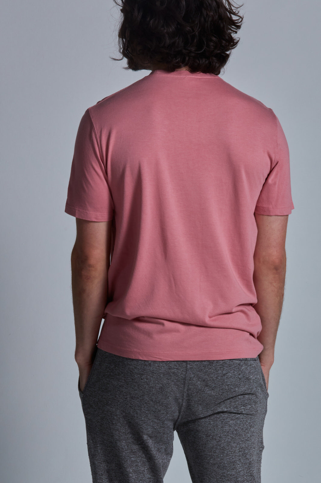 ONNO bamboo t-shirt in Vintage Pink Unpatched, Nic is 5'11" and wearing size M.