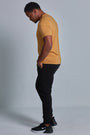 ONNO bamboo t-shirt in Mustard Unpatched, Golden is 6'0" and wearing size L.