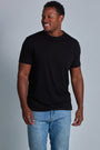 ONNO bamboo t-shirt in Black Unpatched, Golden is 6'0" and wearing size L.