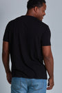ONNO bamboo t-shirt in Black Unpatched, Golden is 6'0" and wearing size L.