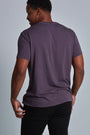 ONNO bamboo t-shirt in Dirty Purple Unpatched, Golden is 6'0" and wearing size L.