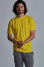 ONNO bamboo t-shirt in Bright Yellow Unpatched, Nic is 5'11" and wearing size M.