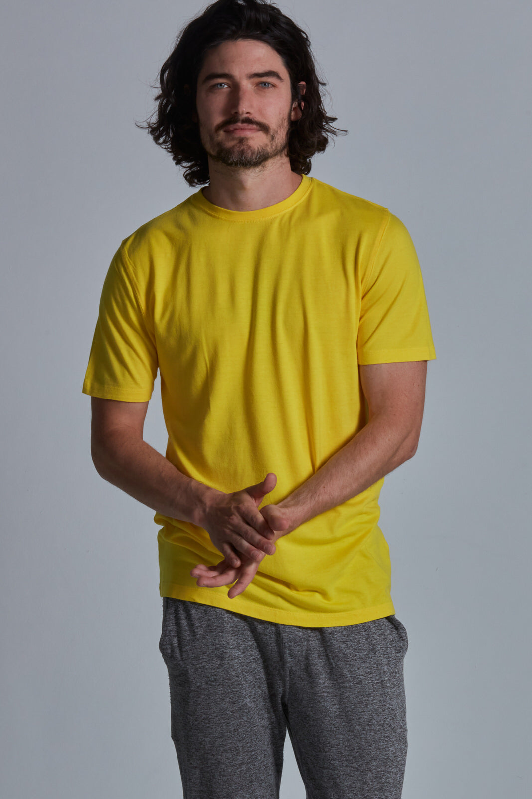 ONNO bamboo t-shirt in Bright Yellow Unpatched, Nic is 5'11" and wearing size M.