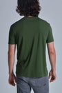 ONNO bamboo t-shirt in Moss Green Unpatched, Nic is 5'11" and wearing size M.