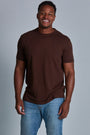ONNO bamboo t-shirt in Espresso Unpatched, Golden is 6'0" and wearing size L.