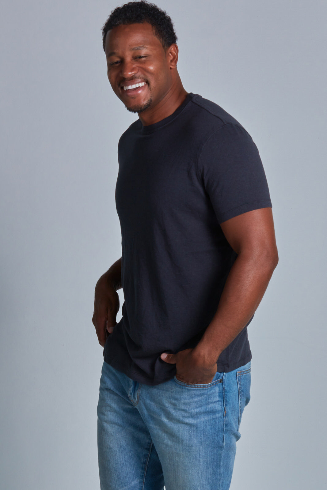 ONNO bamboo t-shirt in Charcoal Blue Unpatched, Golden is 6'0" and wearing size L.