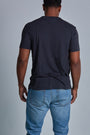 ONNO bamboo t-shirt in Charcoal Blue Unpatched, Golden is 6'0" and wearing size L.