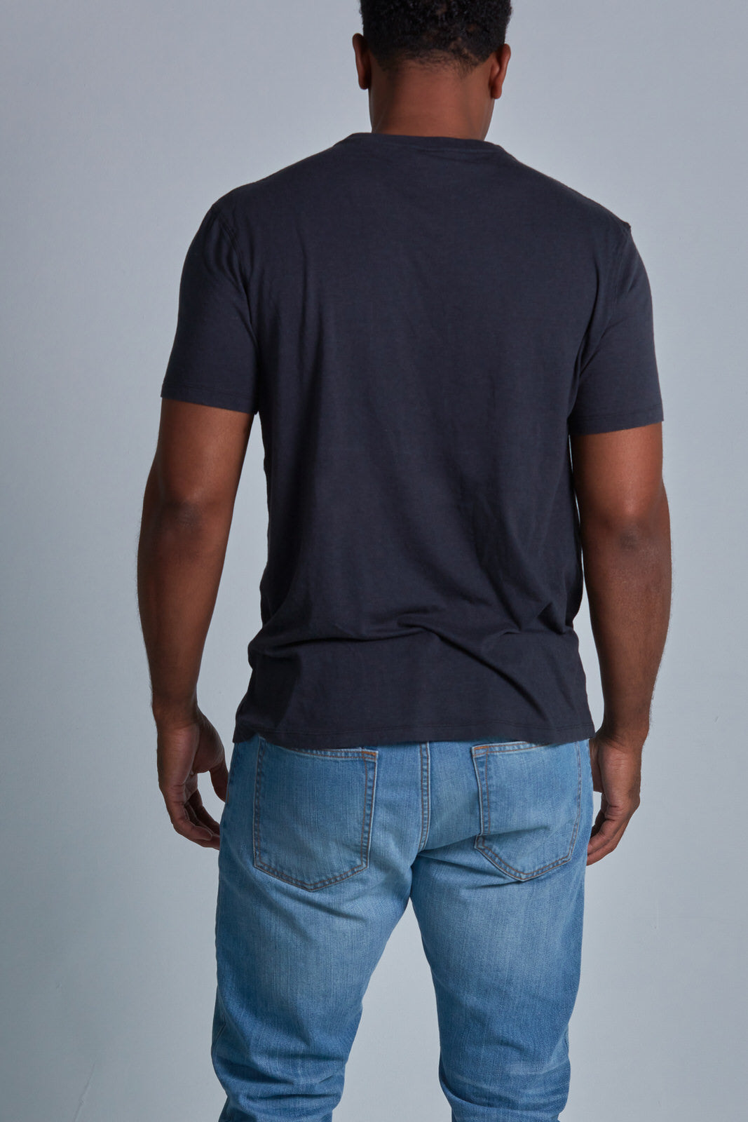 ONNO bamboo t-shirt in Charcoal Blue Unpatched, Golden is 6'0" and wearing size L.