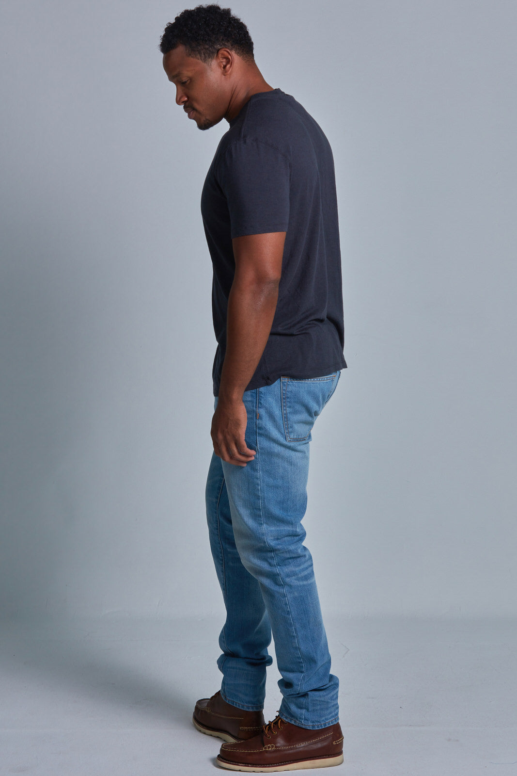 ONNO bamboo t-shirt in Charcoal Blue Unpatched, Golden is 6'0" and wearing size L.