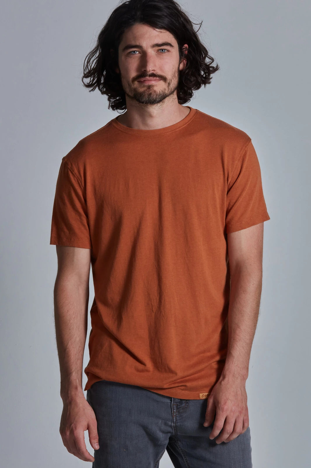 ONNO bamboo t-shirt in Rust, Nic is 5'11" and wearing size M.