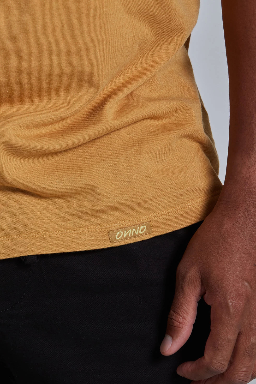 ONNO bamboo t-shirt in Mustard, Golden is 6'0" and wearing size L.