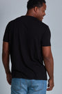 ONNO bamboo t-shirt in Black, Golden is 6'0" and wearing size L.