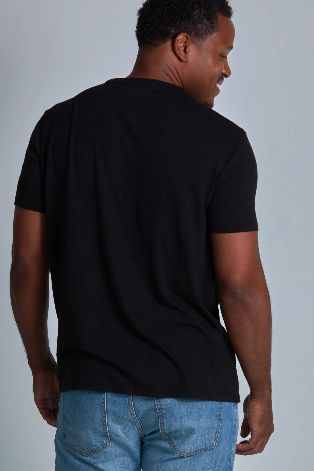 ONNO bamboo t-shirt in Black, Golden is 6'0" and wearing size L.