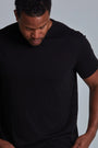 ONNO bamboo t-shirt in Black, Golden is 6'0" and wearing size L.