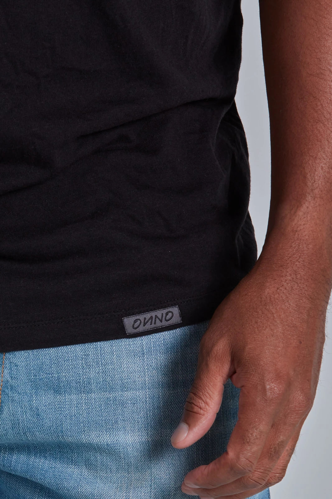 ONNO bamboo t-shirt in Black, Golden is 6'0" and wearing size L.