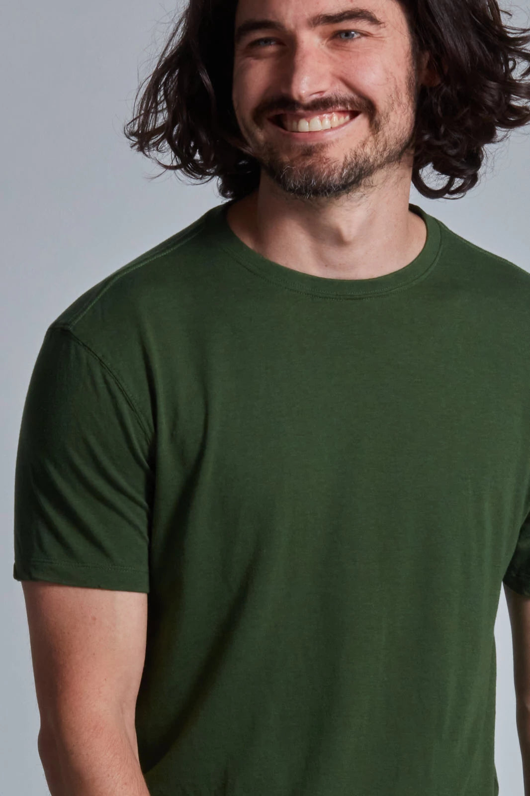 ONNO bamboo t-shirt in Moss Green, Nic is 5'11" and wearing size M.