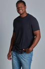 ONNO bamboo t-shirt in Charcoal Blue, Golden is 6'0" and wearing size L.