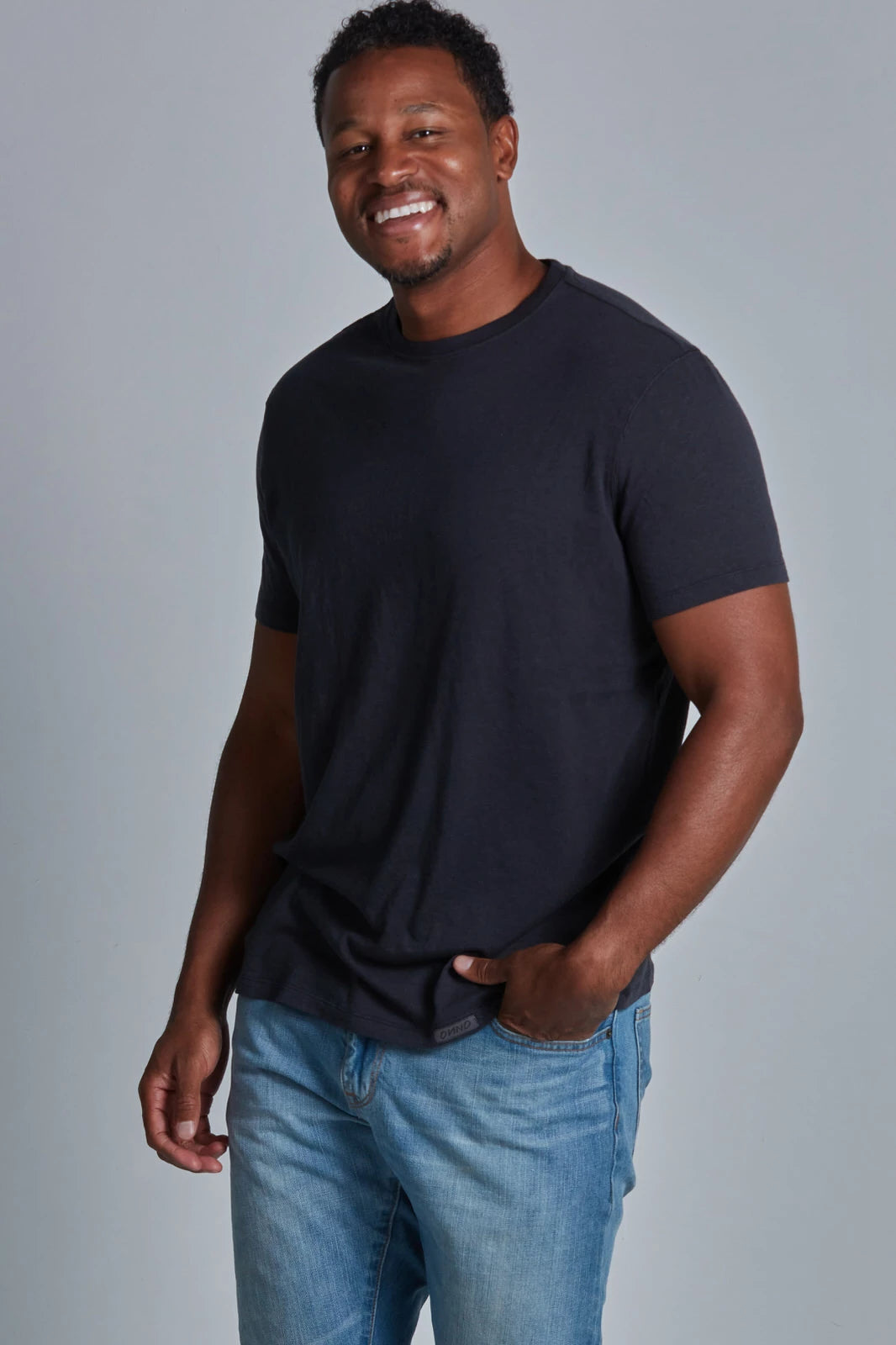 ONNO bamboo t-shirt in Charcoal Blue, Golden is 6'0" and wearing size L.