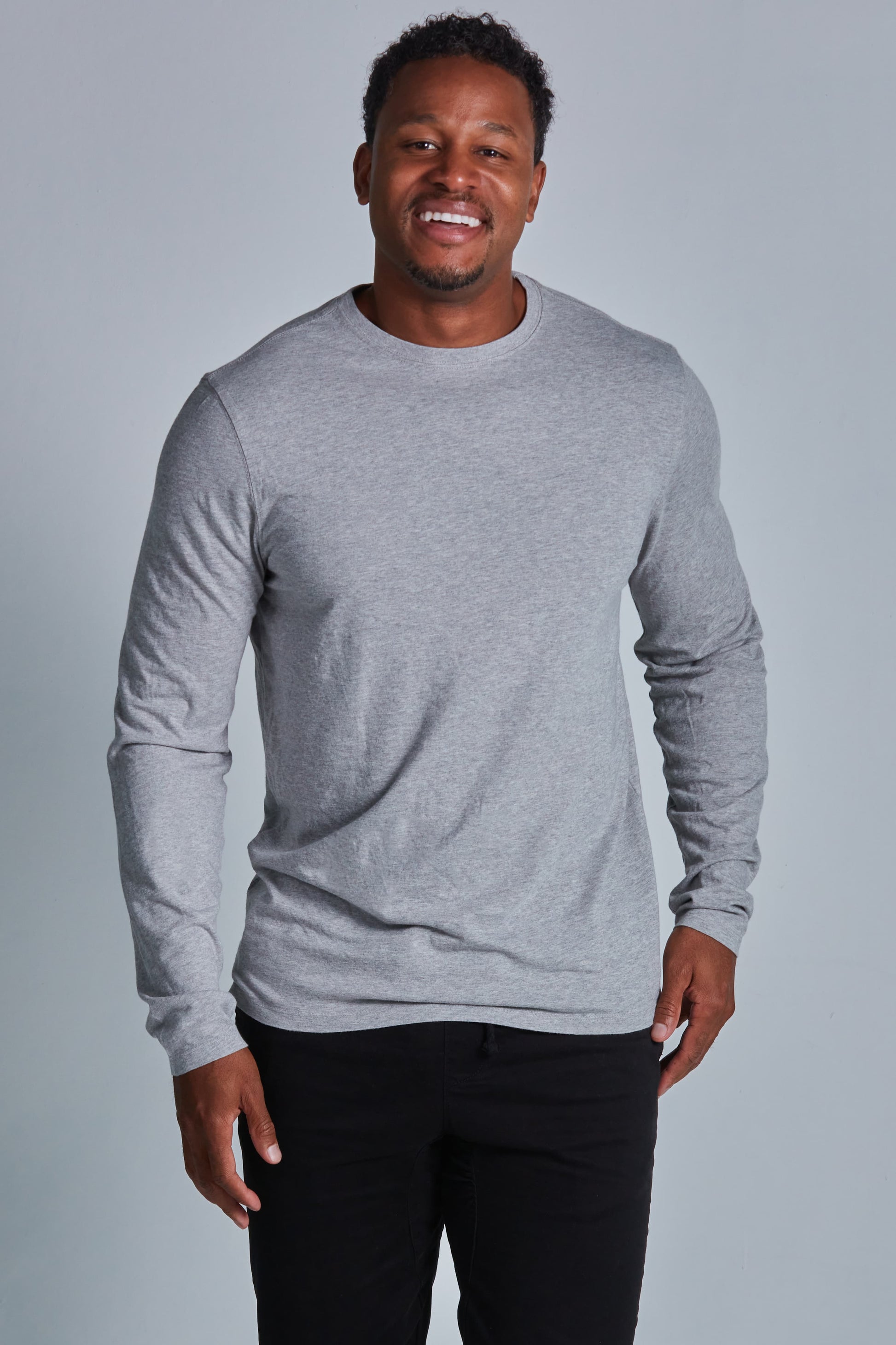 ONNO long sleeve bamboo t-shirt in Heathered Granite Unpatched, Golden is 6'0" and wearing size L.