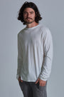 ONNO long sleeve bamboo t-shirt in Natural Unpatched, Nic is 5'11" and wearing size M.