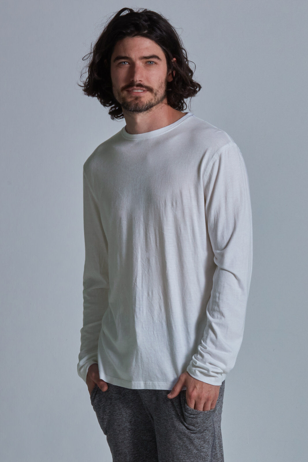 ONNO long sleeve bamboo t-shirt in Natural Unpatched, Nic is 5'11" and wearing size M.