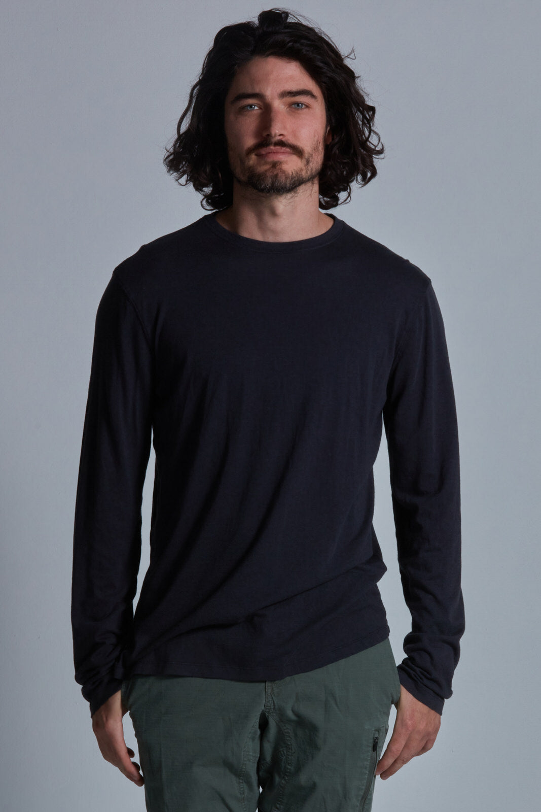 ONNO long sleeve bamboo t-shirt in Charcoal Blue Unpatched, Nic is 5'11" and wearing size M.