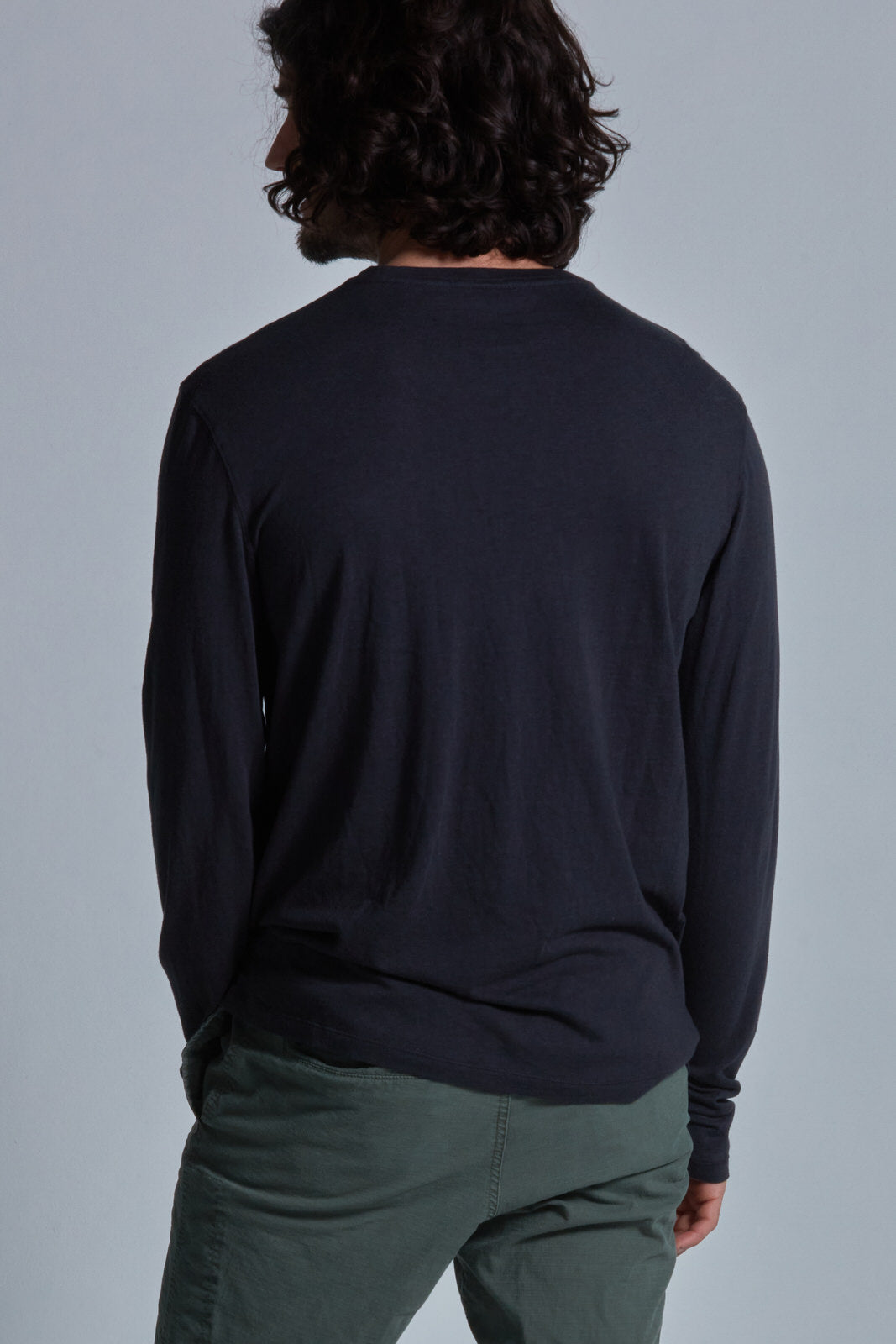 ONNO long sleeve bamboo t-shirt in Charcoal Blue Unpatched, Nic is 5'11" and wearing size M.
