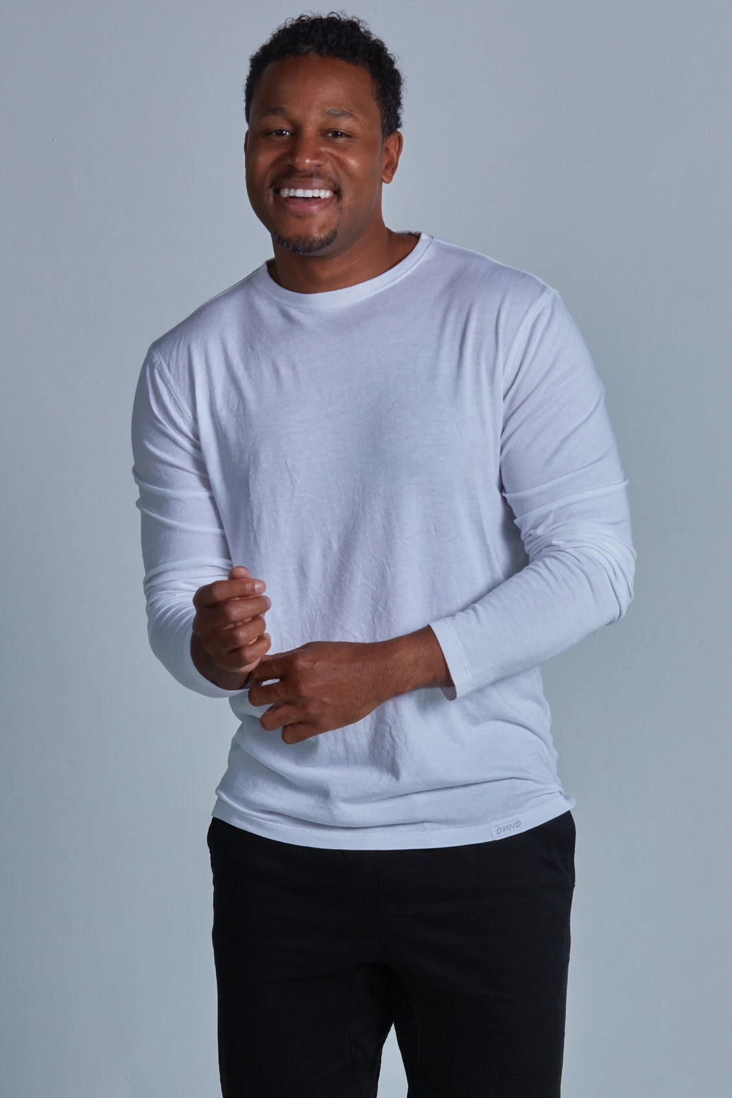 ONNO long sleeve bamboo t-shirt in White, Golden is 6'0" and wearing size L.