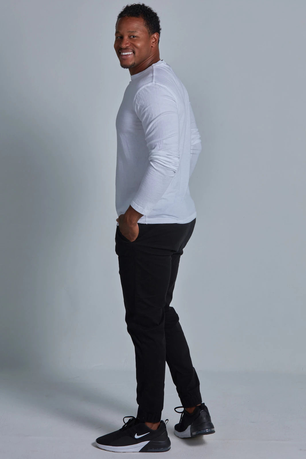 ONNO long sleeve bamboo t-shirt in White, Golden is 6'0" and wearing size L.