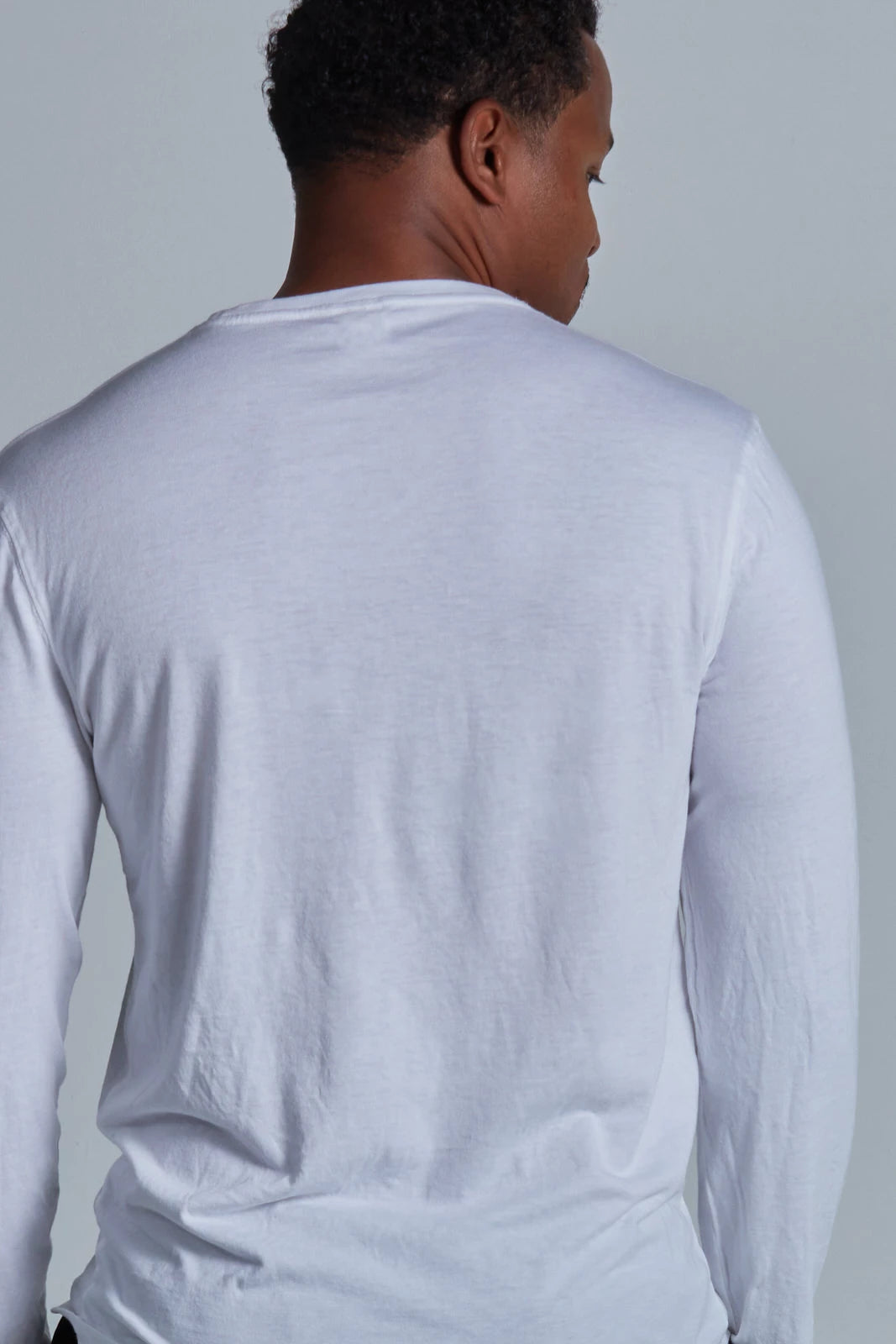 ONNO long sleeve bamboo t-shirt in White, Golden is 6'0" and wearing size L.