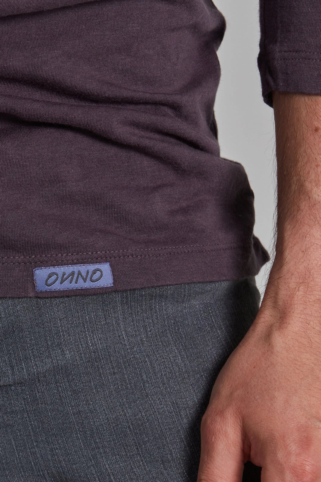 ONNO long sleeve bamboo t-shirt in Dirty Purple, Nic is 5'11" and wearing size M.