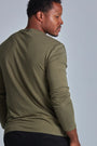 ONNO long sleeve bamboo t-shirt in Cypress, Golden is 6'0" and wearing size L.