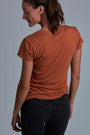 ONNO bamboo t-shirt in Rust Unpatched, Christina is 5'9" and wearing size S.