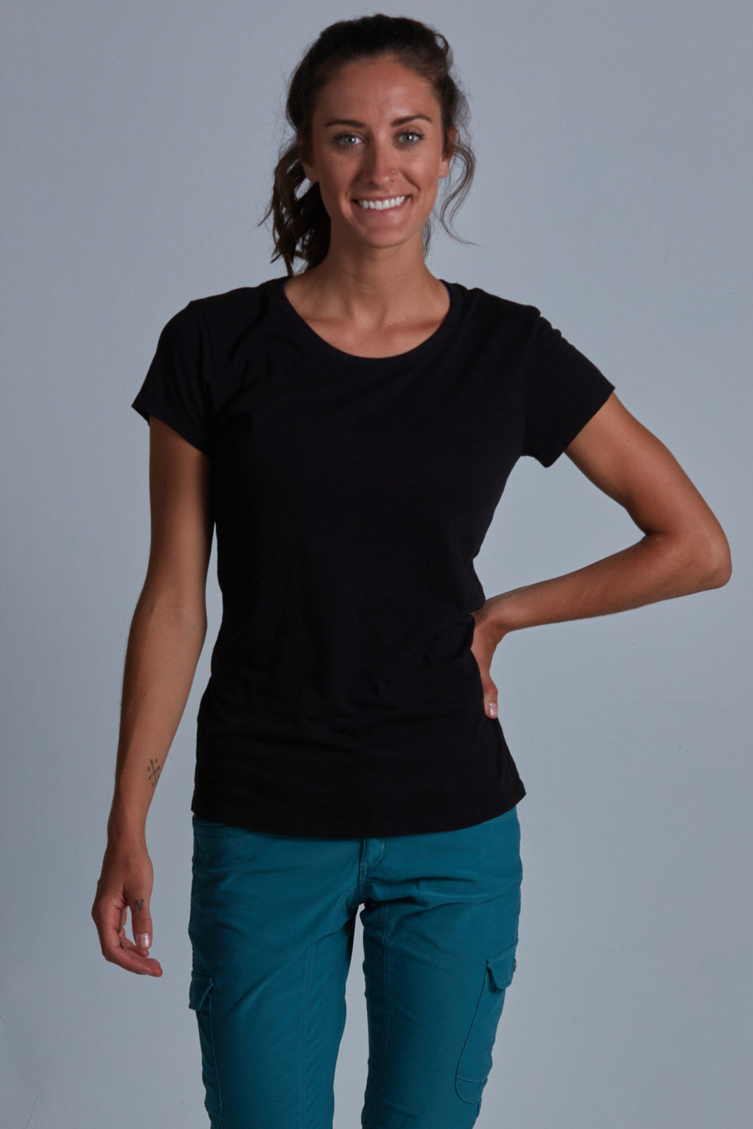 ONNO bamboo t-shirt in Black Unpatched, Christina is 5'9" and wearing size S.