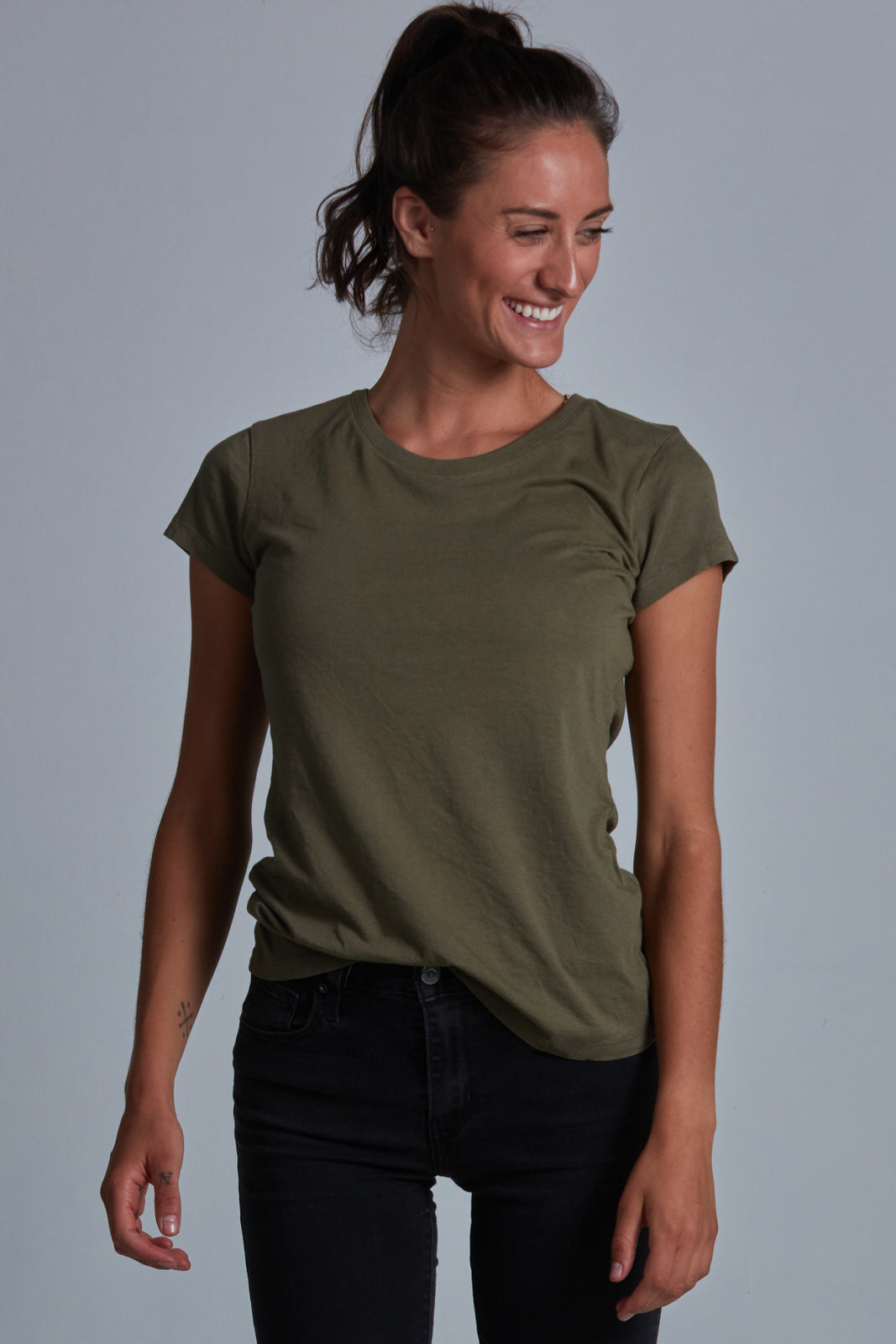 ONNO bamboo t-shirt in Cypress Unpatched, Christina is 5'9" and wearing size S.
