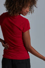 ONNO bamboo t-shirt in Earth Red Unpatched, Sage is 5'7" and wearing size XS.