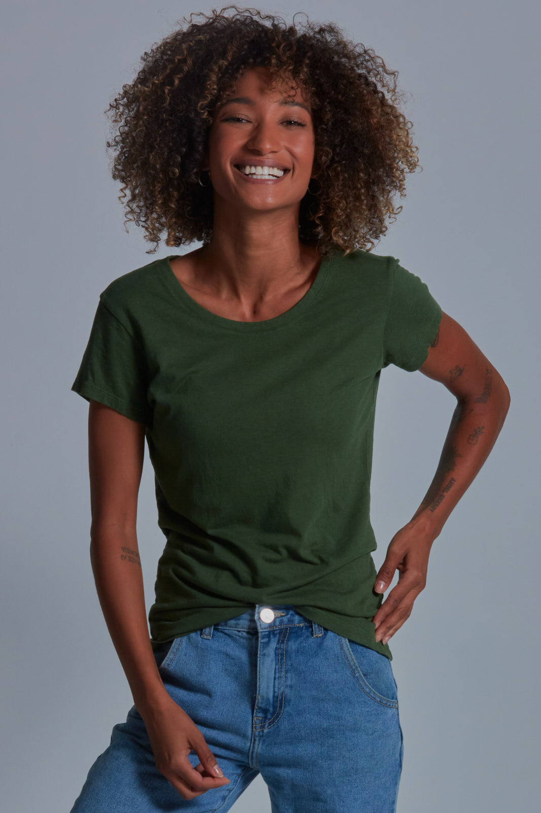 ONNO bamboo t-shirt in Moss Green Unpatched, Sage is 5'7" and wearing size XS.