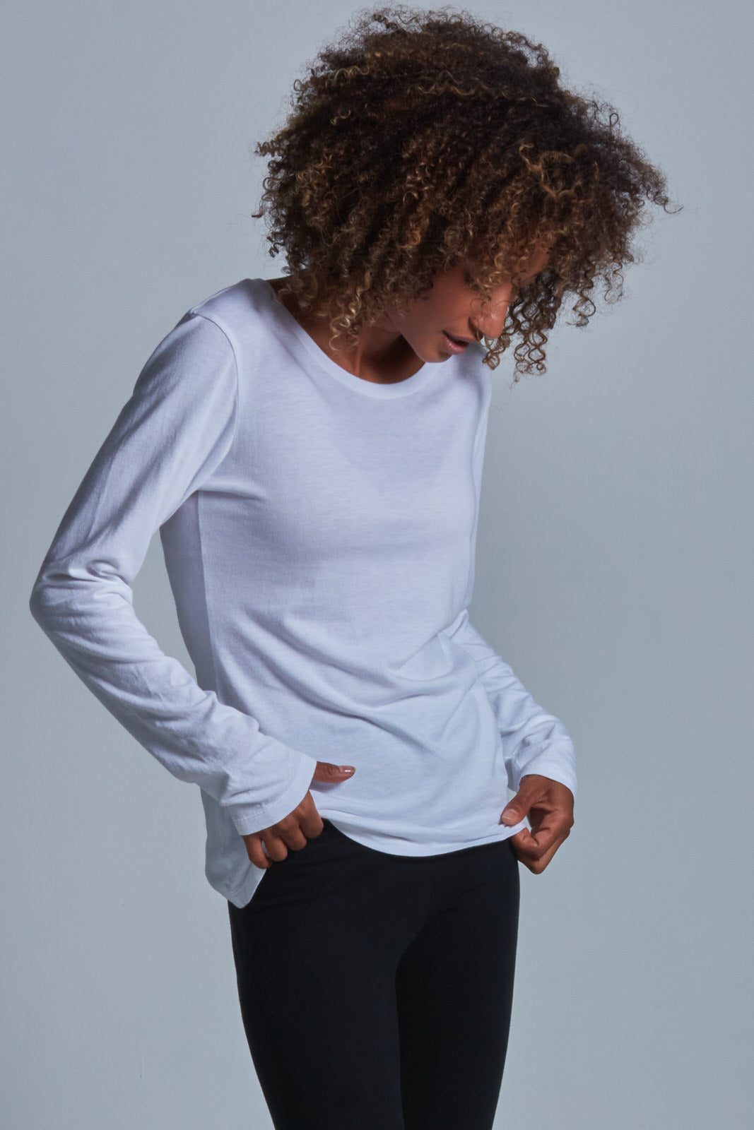 ONNO long sleeve bamboo t-shirt in White Unpatched, Sage is 5'7" and wearing size XS.