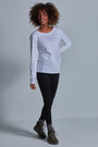 ONNO long sleeve bamboo t-shirt in White Unpatched, Sage is 5'7" and wearing size XS.