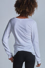 ONNO long sleeve bamboo t-shirt in White Unpatched, Sage is 5'7" and wearing size XS.