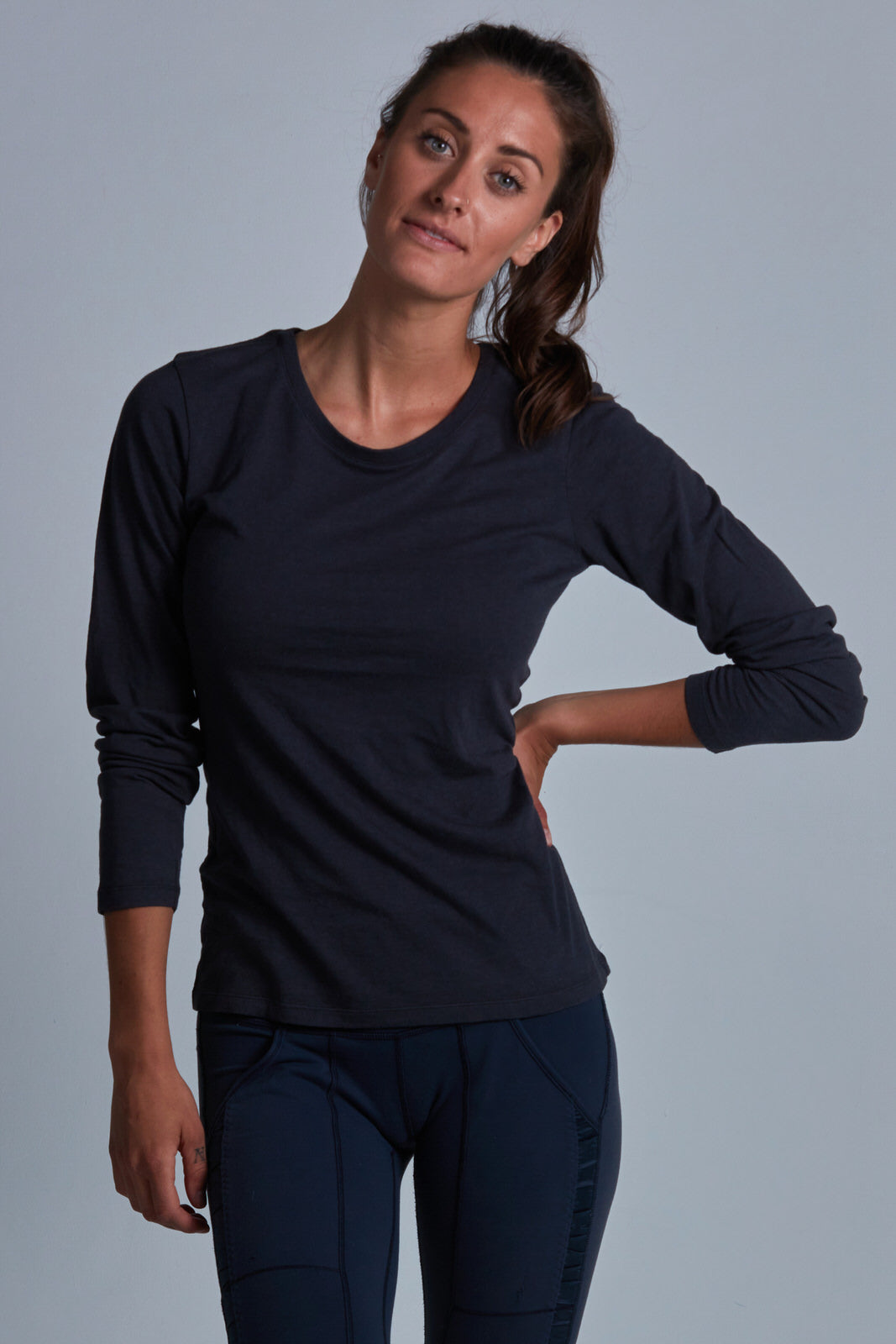 ONNO long sleeve bamboo t-shirt in Charcoal Blue Unpatched, Christina is 5'9" and wearing size S.