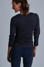 ONNO long sleeve bamboo t-shirt in Charcoal Blue Unpatched, Christina is 5'9" and wearing size S.