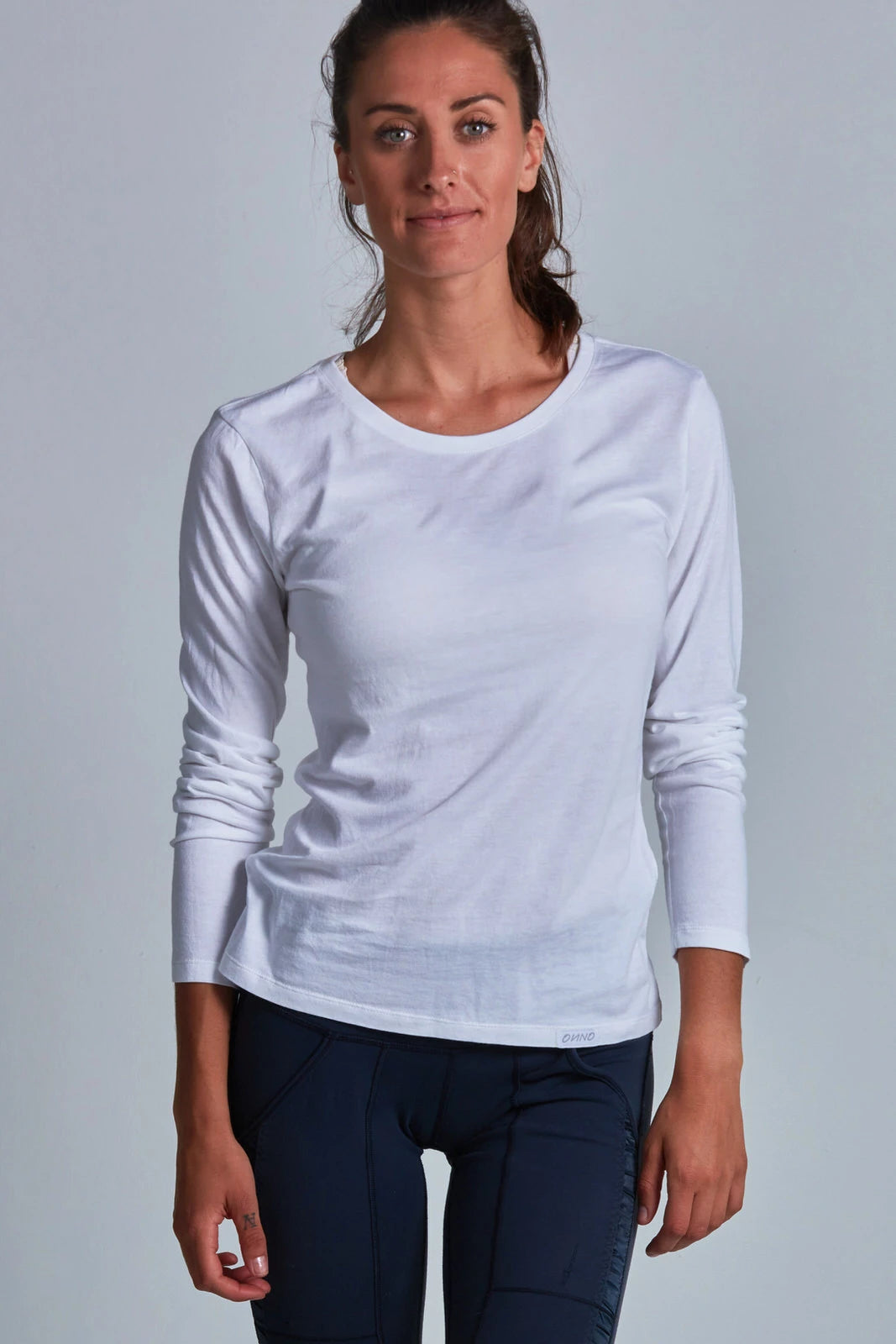 ONNO long sleeve bamboo t-shirt in White, Christina is 5'9" and wearing size S.