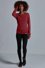 ONNO long sleeve bamboo t-shirt in Brick, Sage is 5'7" and wearing size XS.