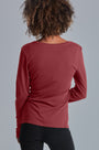 ONNO long sleeve bamboo t-shirt in Brick, Sage is 5'7" and wearing size XS.