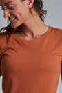 ONNO long sleeve bamboo t-shirt in Rust, Christina is 5'9" and wearing size S.
