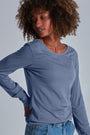 ONNO long sleeve bamboo t-shirt in Stone, Sage is 5'7" and wearing size XS.