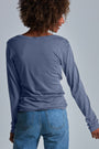 ONNO long sleeve bamboo t-shirt in Stone, Sage is 5'7" and wearing size XS.